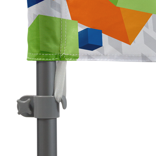 Flag attaches to pole set with tab