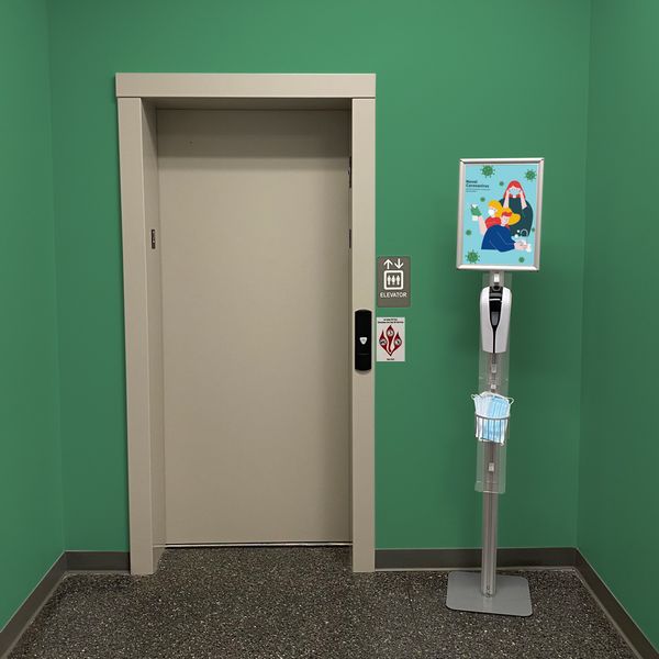 Allow guests to sanitize and grab a face mask before entering