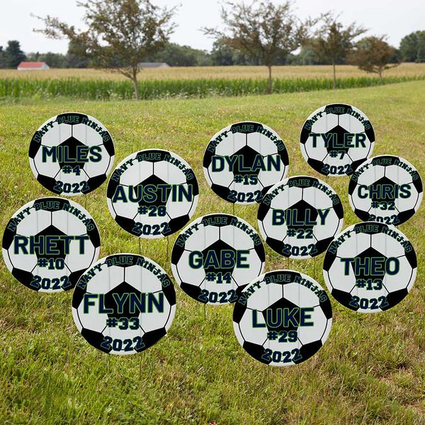 Soccer signs displayed in a yard