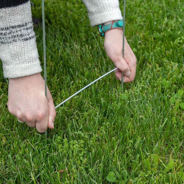 Inserting step stakes into the ground Inserting step stakes into the ground