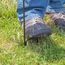 Hardware stakes into ground Hardware is staked into the ground with a foot